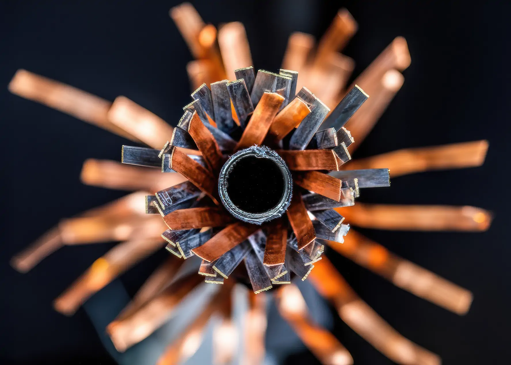 Cross-section of a high-temperature superconducting ribbon cable with conductors splayed out like a flower